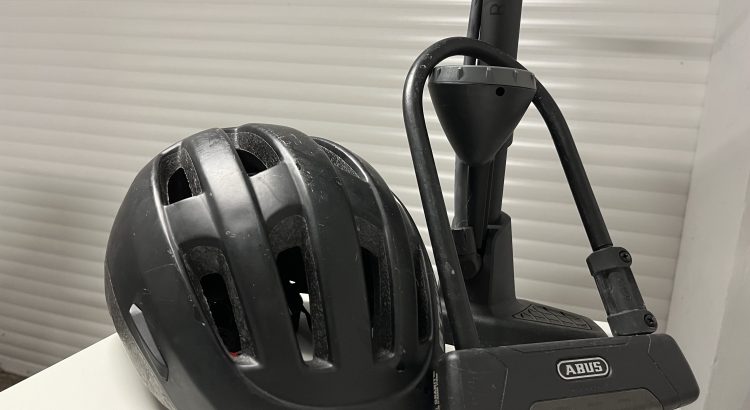 Photo of a helmet, bike lock and floor pump